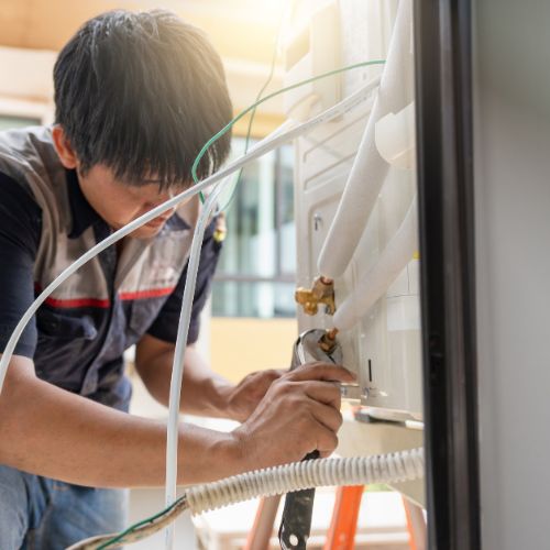 hvac technician repairs air conditioning system hvac technician repairs air conditioning system